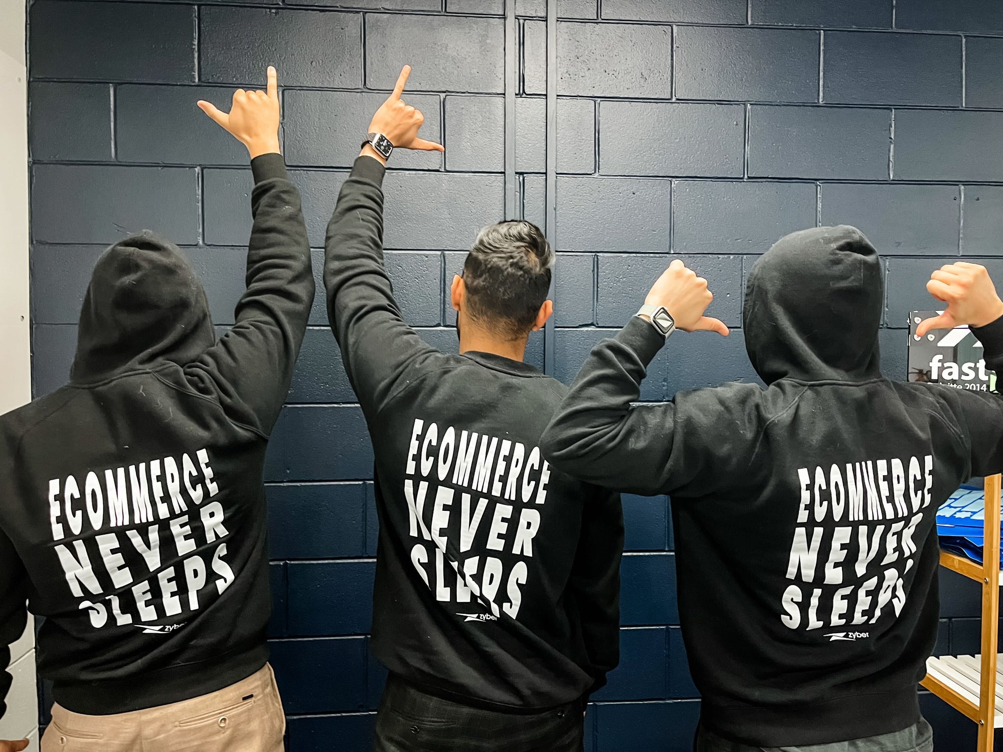 Zyber teams wearing eCommerce never sleeps logo hoodie